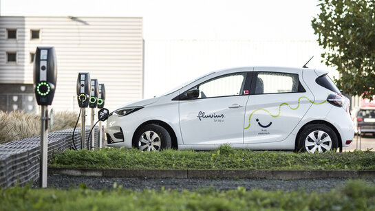 Fluvius car at a charging station
